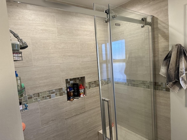 bathroom featuring an enclosed shower