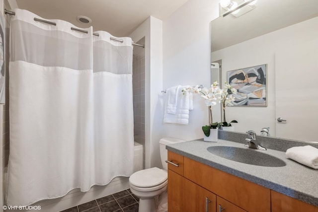 full bathroom featuring toilet, vanity, tile patterned floors, and shower / bath combo with shower curtain