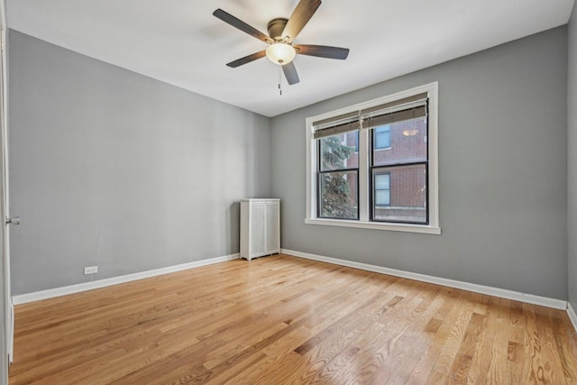 empty room with light hardwood / wood-style floors and ceiling fan