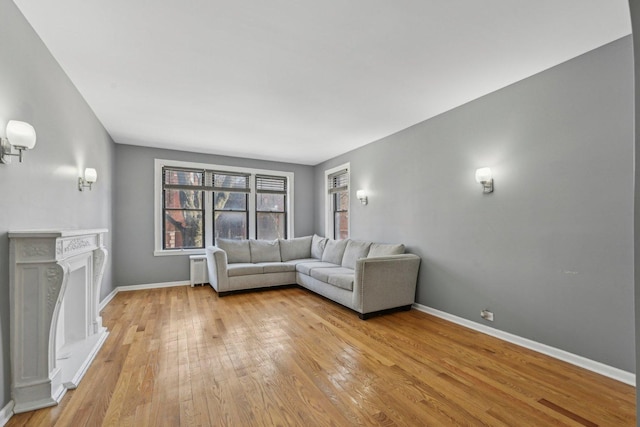 unfurnished living room featuring light hardwood / wood-style flooring