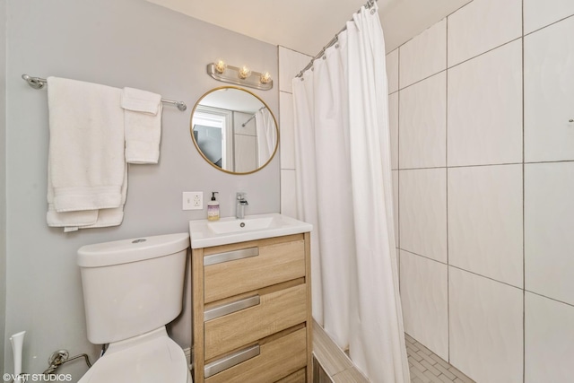 bathroom featuring vanity, toilet, and a shower with shower curtain