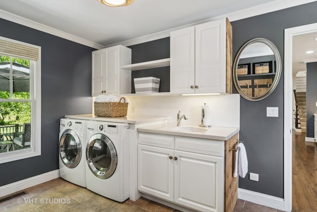 5605 Farmbrook Ln, Crystal Lake, IL 60014 - washroom with washing machine and clothes dryer, cabinet space, and baseboards
