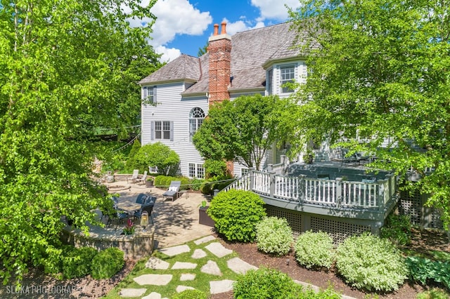 5605 Farmbrook Ln, Crystal Lake, IL 60014 - back of house with a deck, a chimney, and a patio