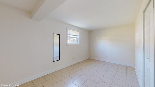 empty room with beam ceiling