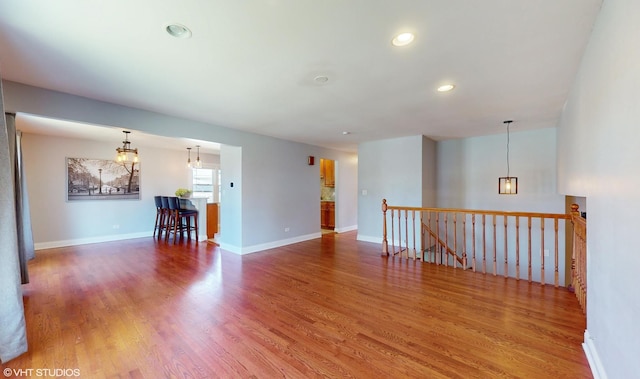 unfurnished room with hardwood / wood-style floors