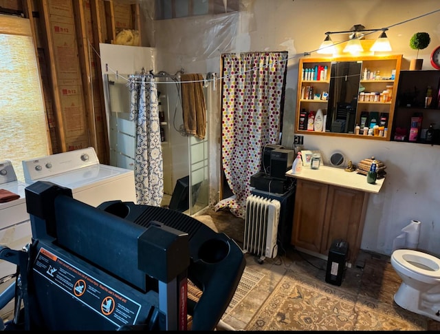 interior space with radiator and washer and dryer