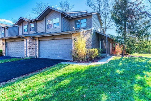 view of front facade featuring a garage and a front yard