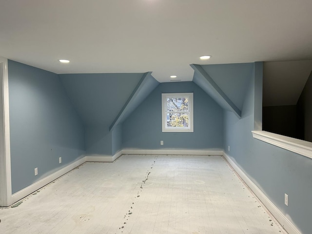 additional living space with vaulted ceiling