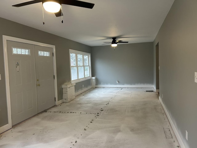 entrance foyer with ceiling fan