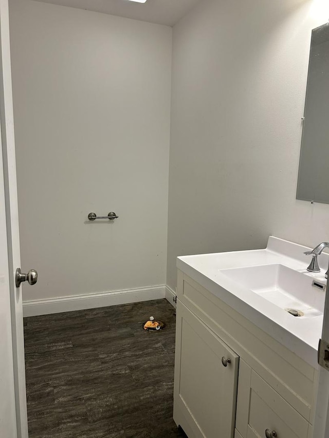 bathroom with vanity and hardwood / wood-style flooring