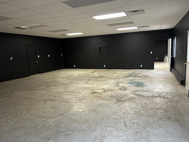 empty room featuring a paneled ceiling