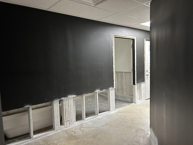 corridor featuring a paneled ceiling