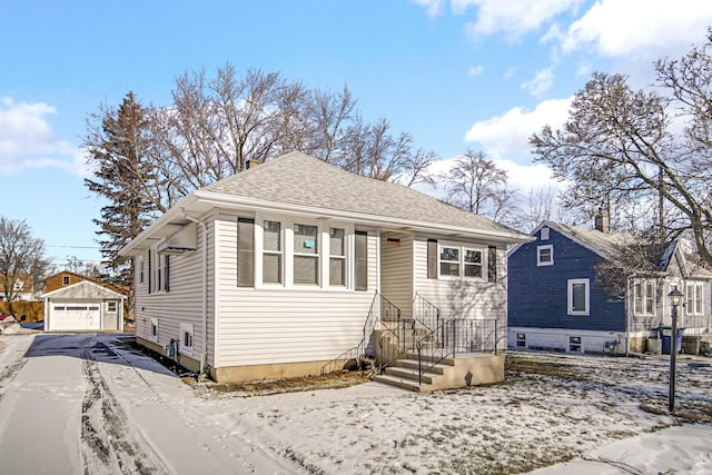 bungalow with an outbuilding and a garage