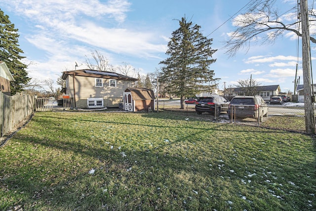 view of yard featuring a storage unit