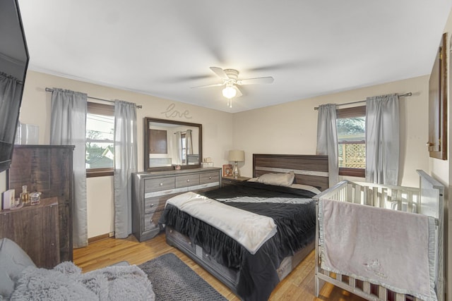 bedroom featuring ceiling fan and light hardwood / wood-style floors