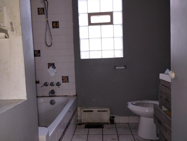 bathroom with tile patterned flooring, a baseboard heating unit, and toilet