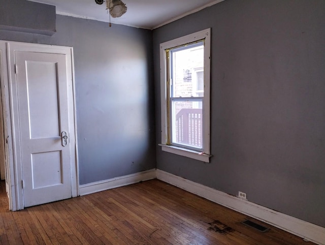 empty room featuring hardwood / wood-style flooring