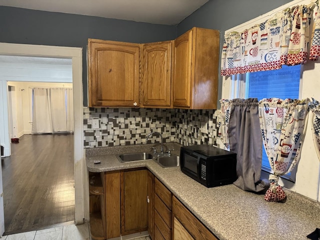 kitchen with sink and decorative backsplash