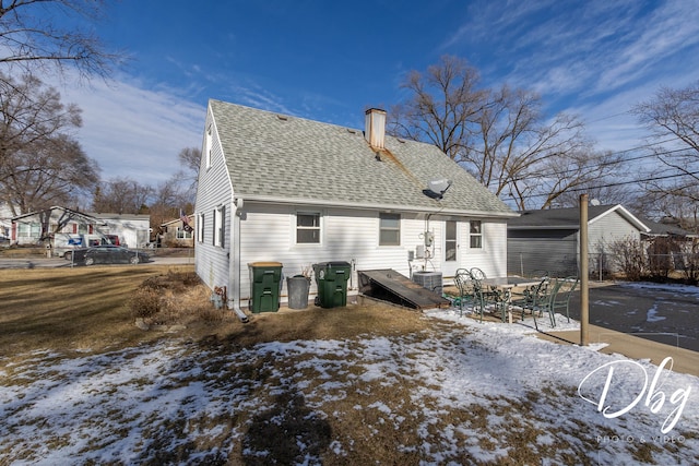 snow covered property featuring cooling unit