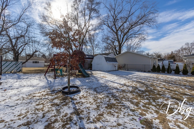 exterior space featuring a playground and a shed