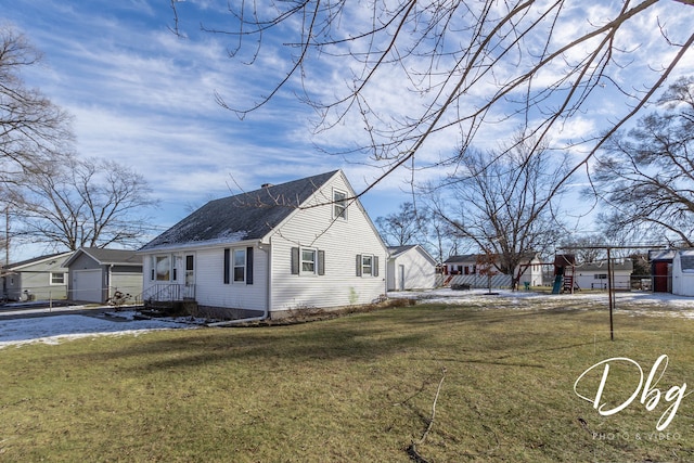 view of home's exterior with a garage and a yard