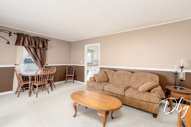 living room with ornamental molding and carpet floors