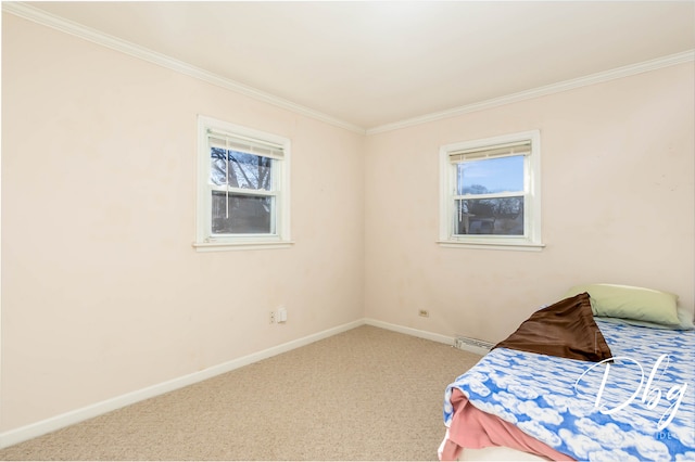 bedroom featuring crown molding, carpet floors, and a baseboard radiator