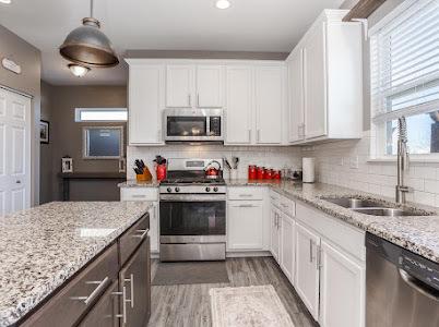 26011 S Old Farm Ct, Channahon, IL 60410 - kitchen featuring appliances with stainless steel finishes, a sink, plenty of natural light, light wood-style floors, and recessed lighting