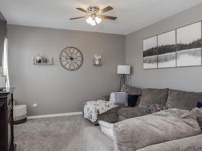 26011 S Old Farm Ct, Channahon, IL 60410 - carpeted living area featuring a ceiling fan and baseboards