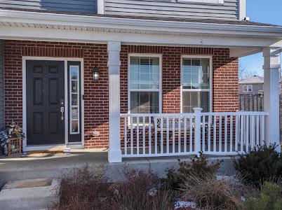 26011 S Old Farm Ct, Channahon, IL 60410 - doorway to property featuring brick siding and a porch