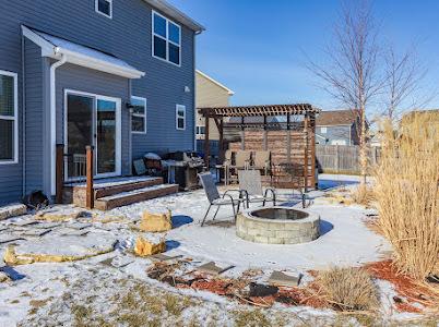 26011 S Old Farm Ct, Channahon, IL 60410 - snow covered patio featuring an outdoor fire pit, a pergola, and fence