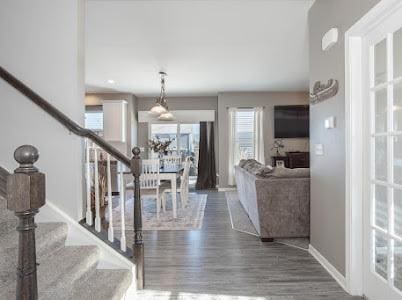 26011 S Old Farm Ct, Channahon, IL 60410 - foyer with stairway, wood finished floors, and baseboards