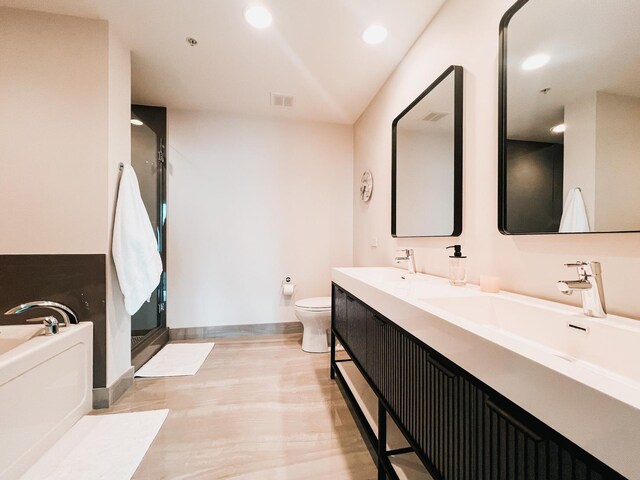 bedroom featuring a view of city, visible vents, expansive windows, wood finished floors, and baseboards