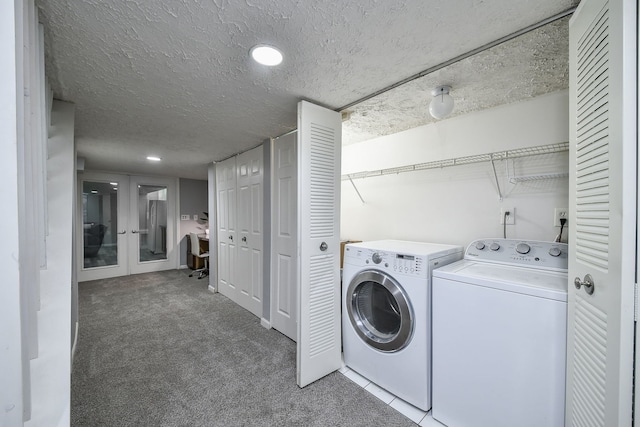 laundry room featuring separate washer and dryer, carpet floors, a textured ceiling, and french doors