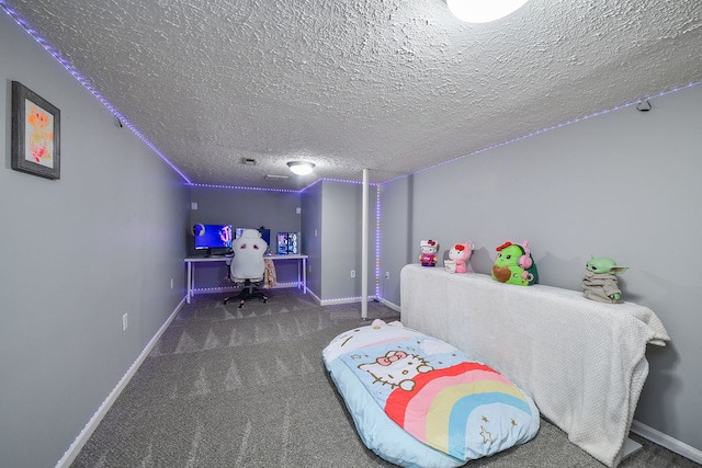 carpeted bedroom featuring a textured ceiling