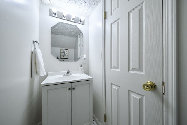 bathroom featuring vanity and a textured ceiling