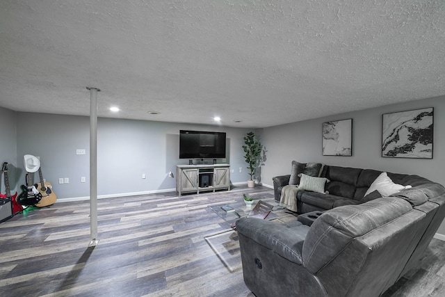 living room featuring hardwood / wood-style floors and a textured ceiling