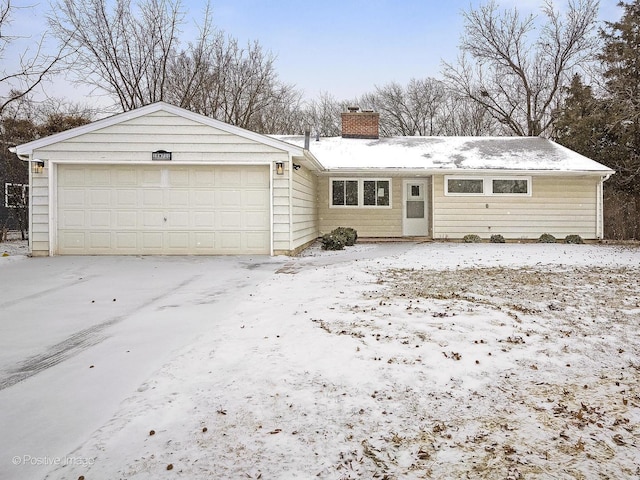 single story home featuring a garage