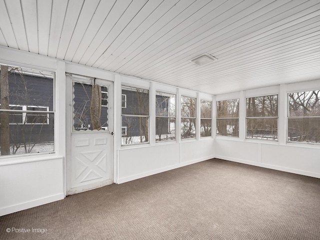 unfurnished sunroom with wooden ceiling