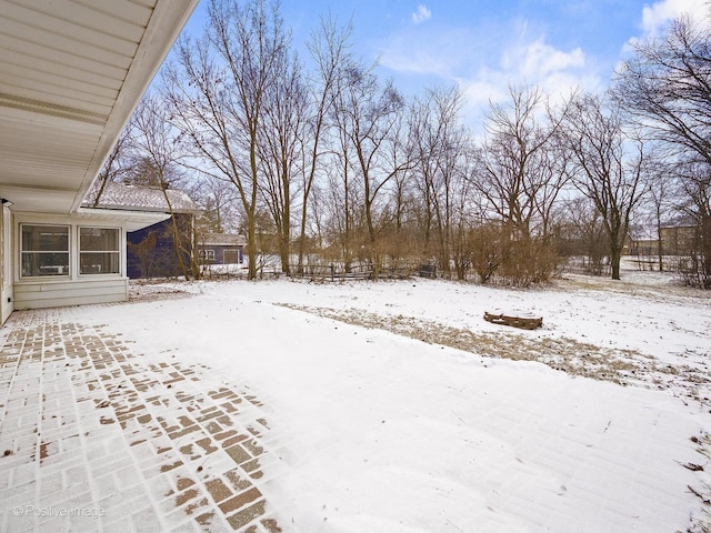 view of yard layered in snow