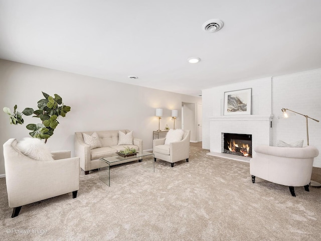 living room with light carpet and a brick fireplace