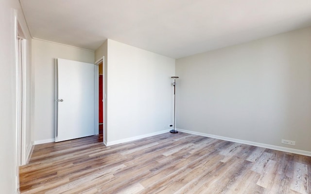 unfurnished room with light hardwood / wood-style flooring