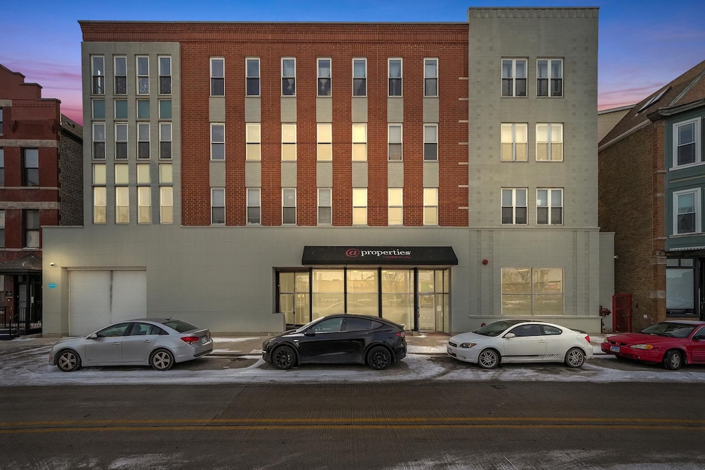 view of outdoor building at dusk