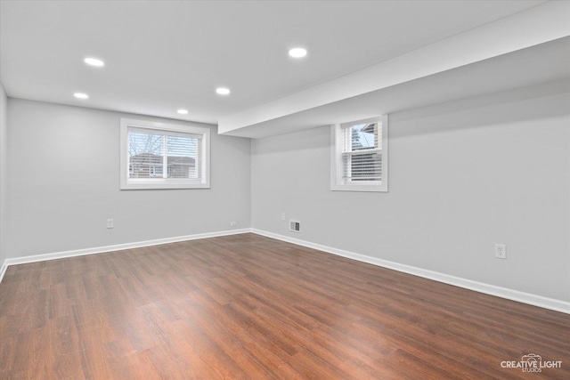 basement featuring dark hardwood / wood-style floors