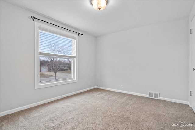 empty room featuring carpet flooring