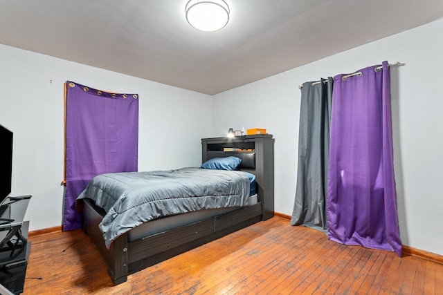 bedroom with hardwood / wood-style flooring