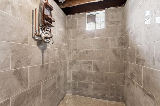 bathroom with tiled shower