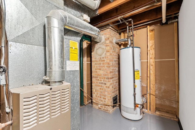 utility room featuring water heater