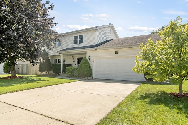 view of front property with a front yard and a garage