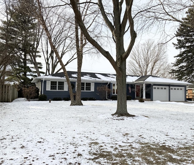 single story home featuring a garage